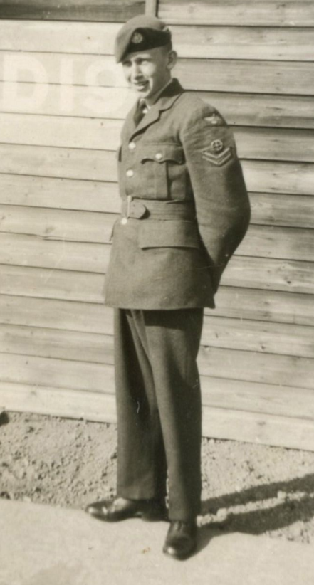 A man stands in military uniform