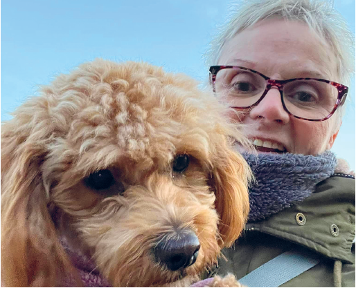 Sue Noakes with a curly dog
