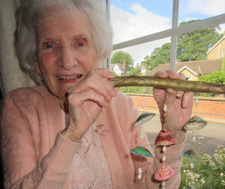Heather's mum with a shell hanging mobile