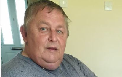 Peter Harris' sat indoors and looking at the camera