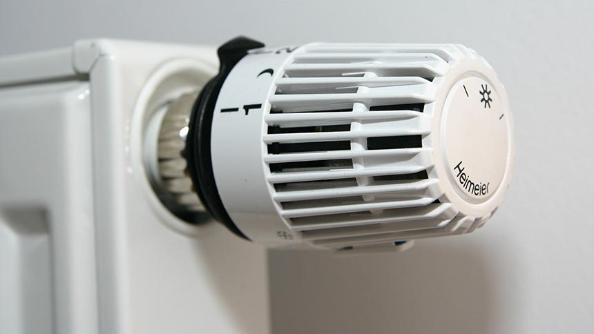 A close up picture of a temperature control knob on a radiator