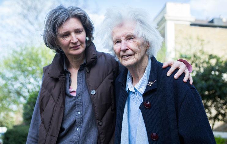 A woman supporting another.