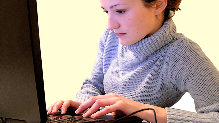 Someone using a laptop computer