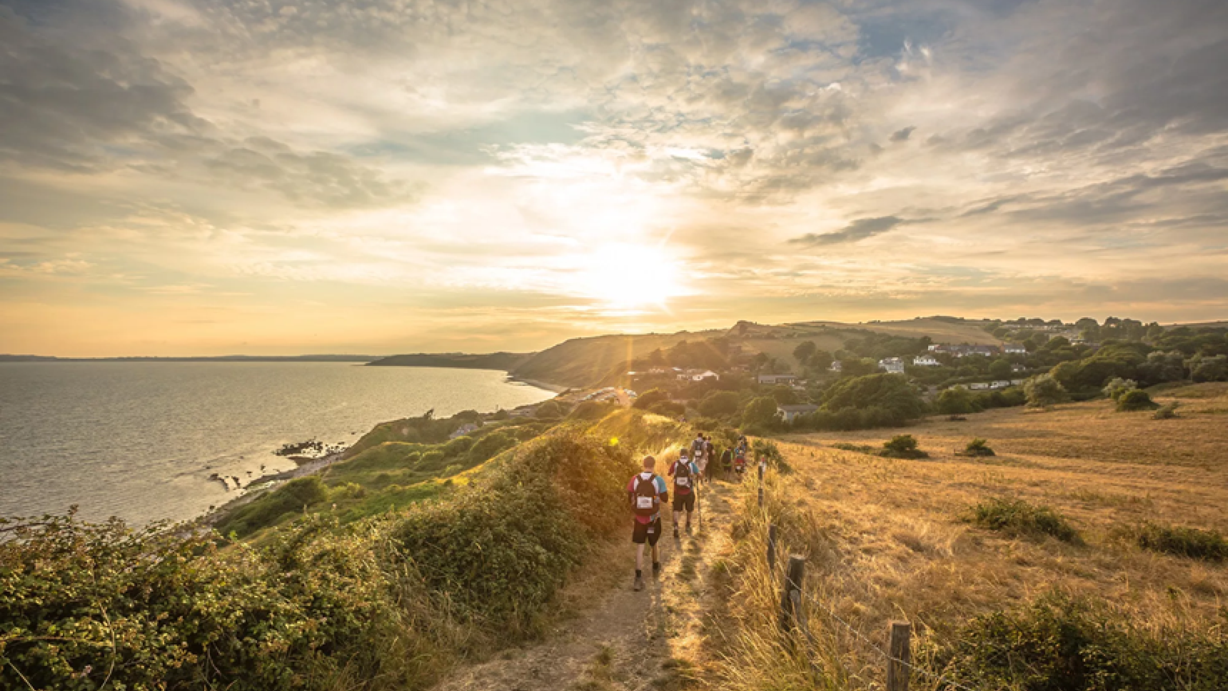 Jurassic Coast sunrise with walkers