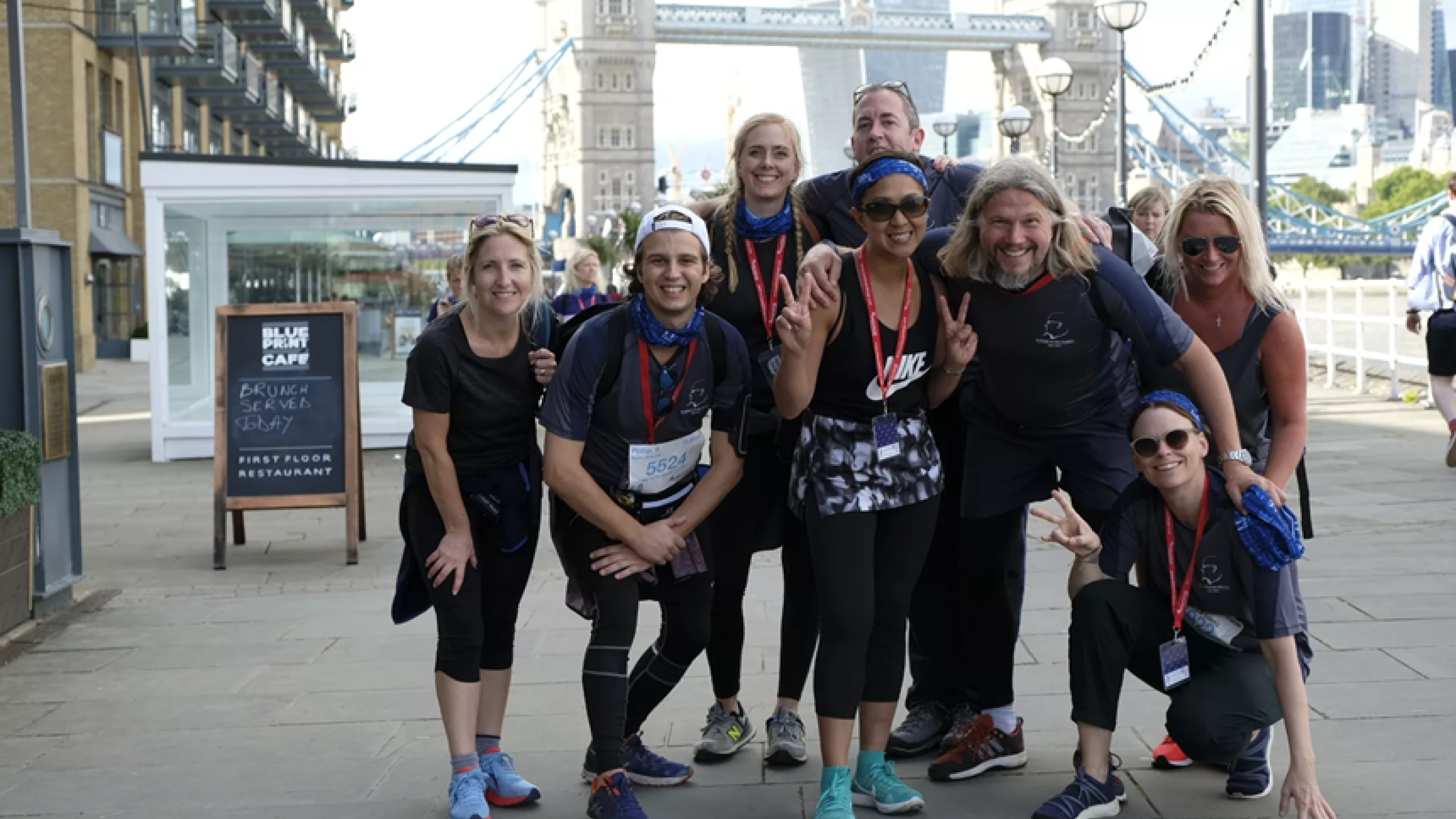 group photo with Tower Bridge at sunrise 