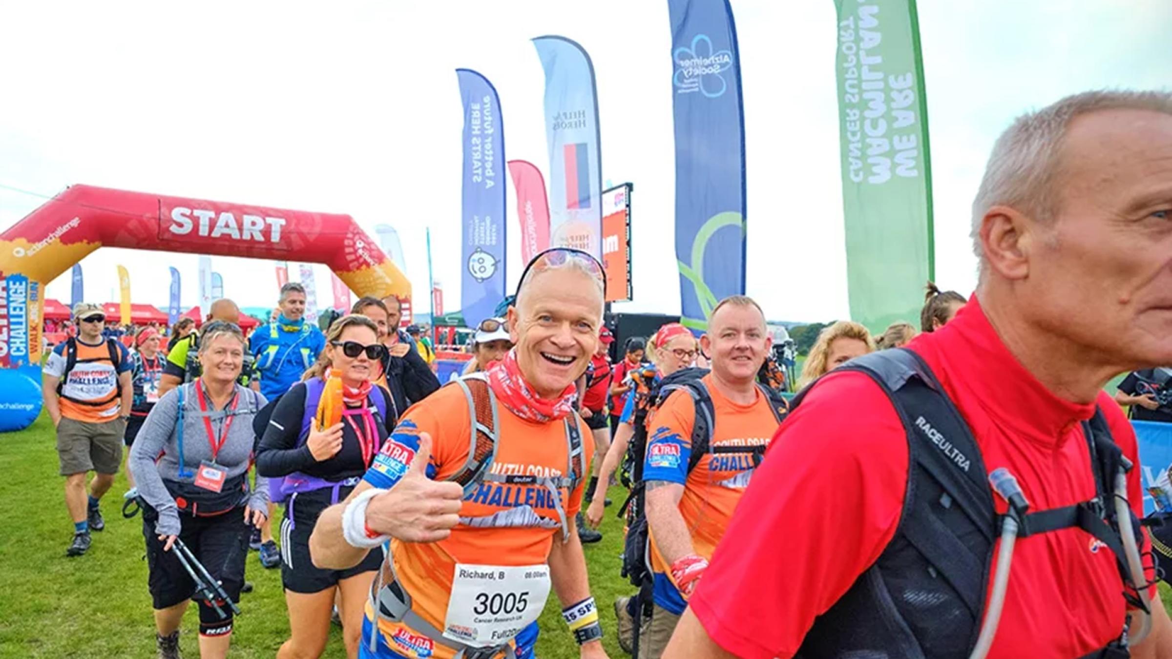Group of walkers in a field of long grass
