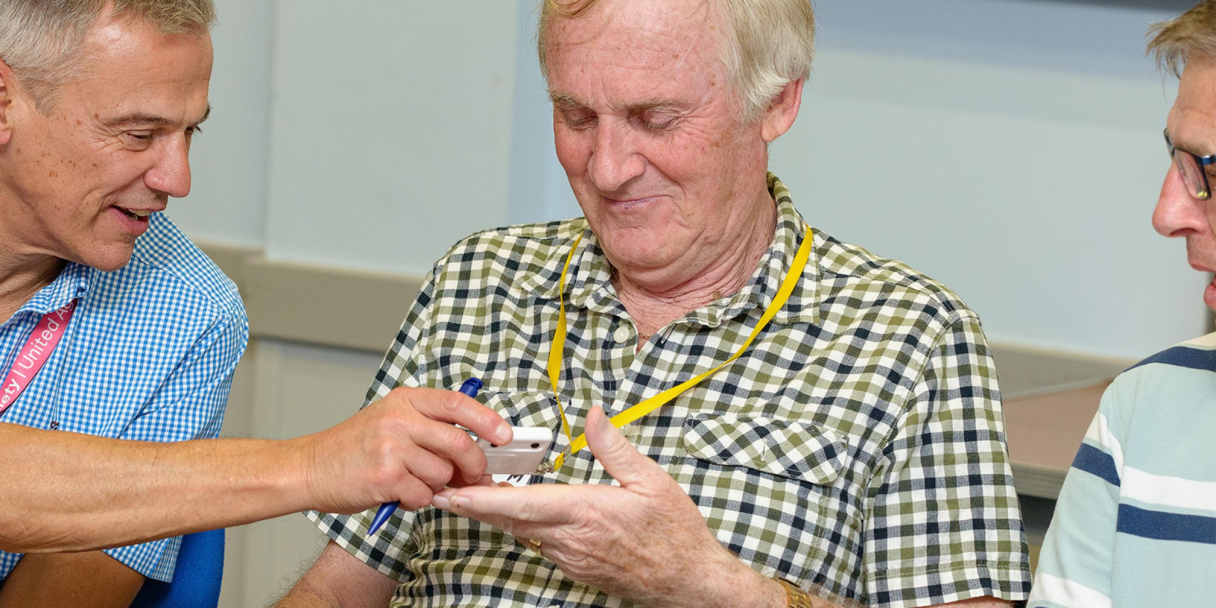 People trying out daily living aids