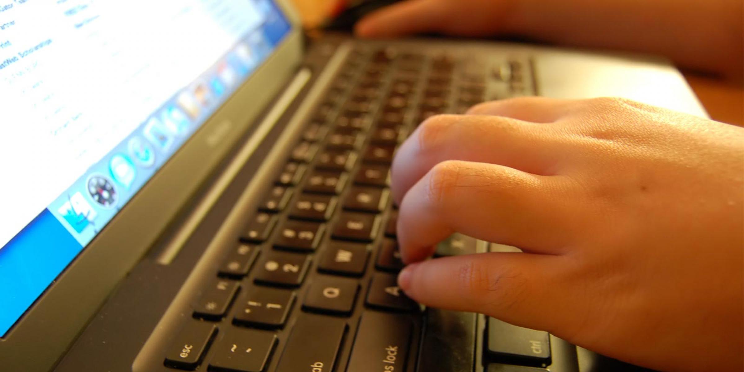 Someone using a computer keyboard