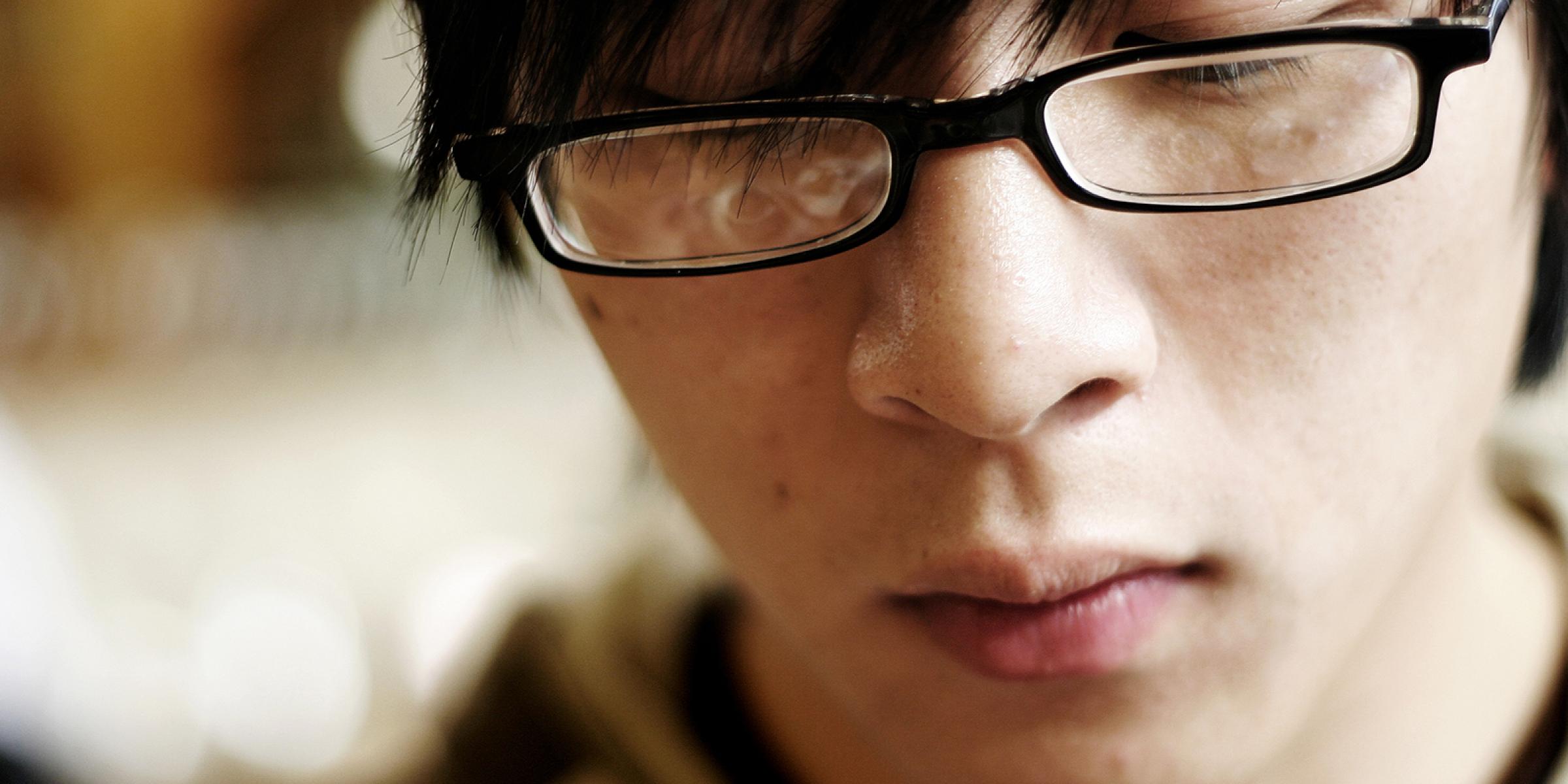 Teenager looking down