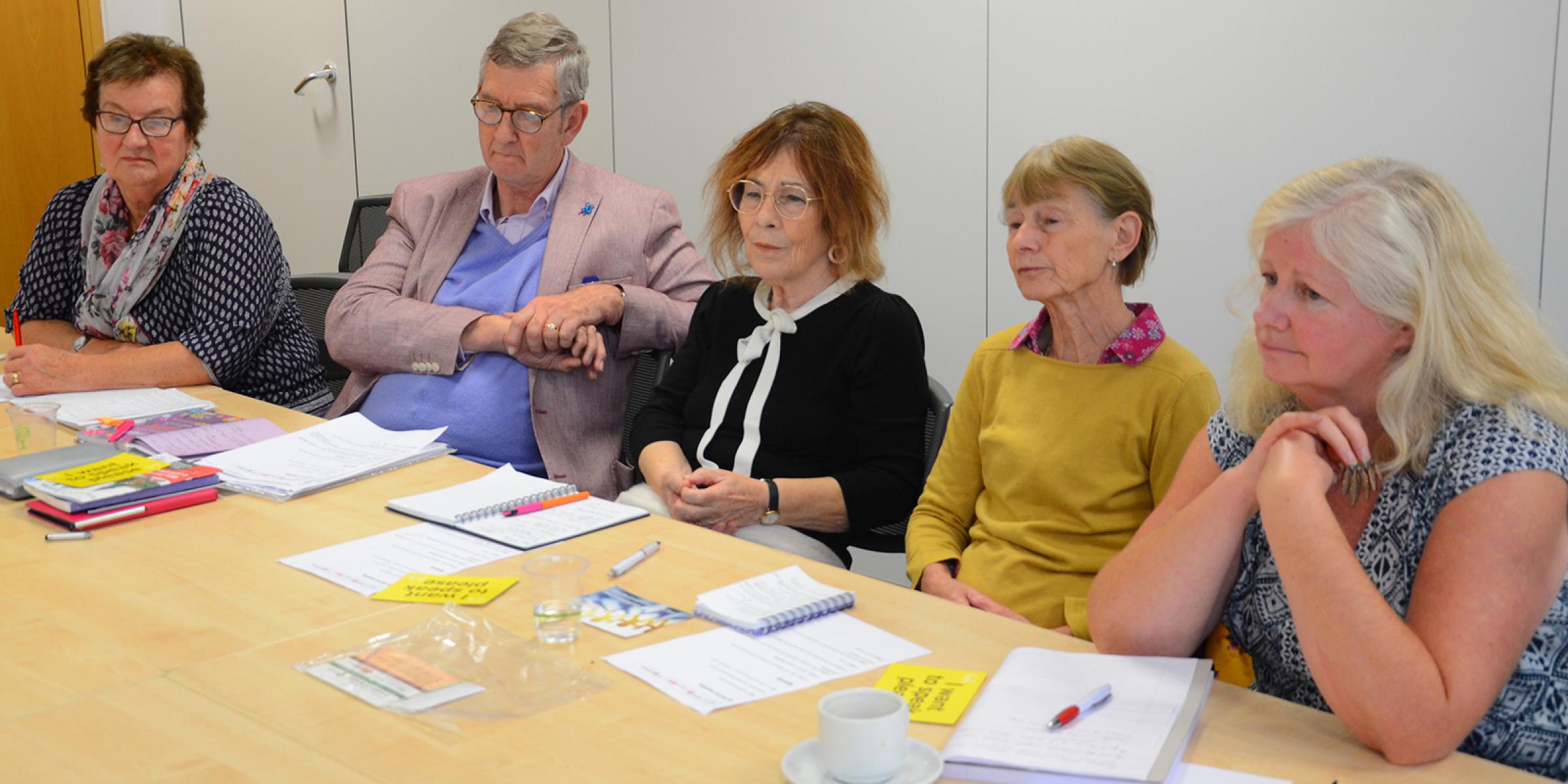 Five members of the Always group at a meeting