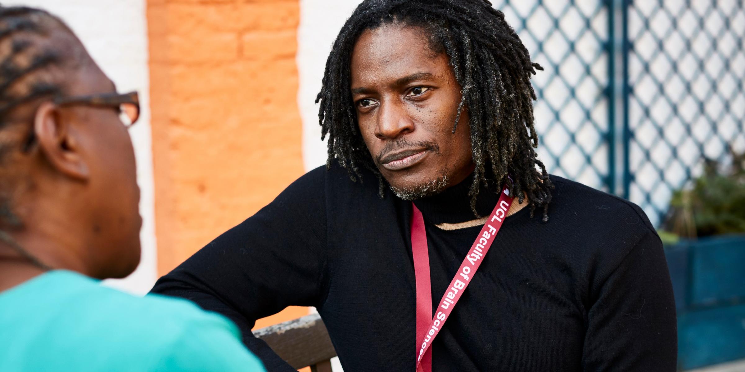 Moise Roche listening to a research participant