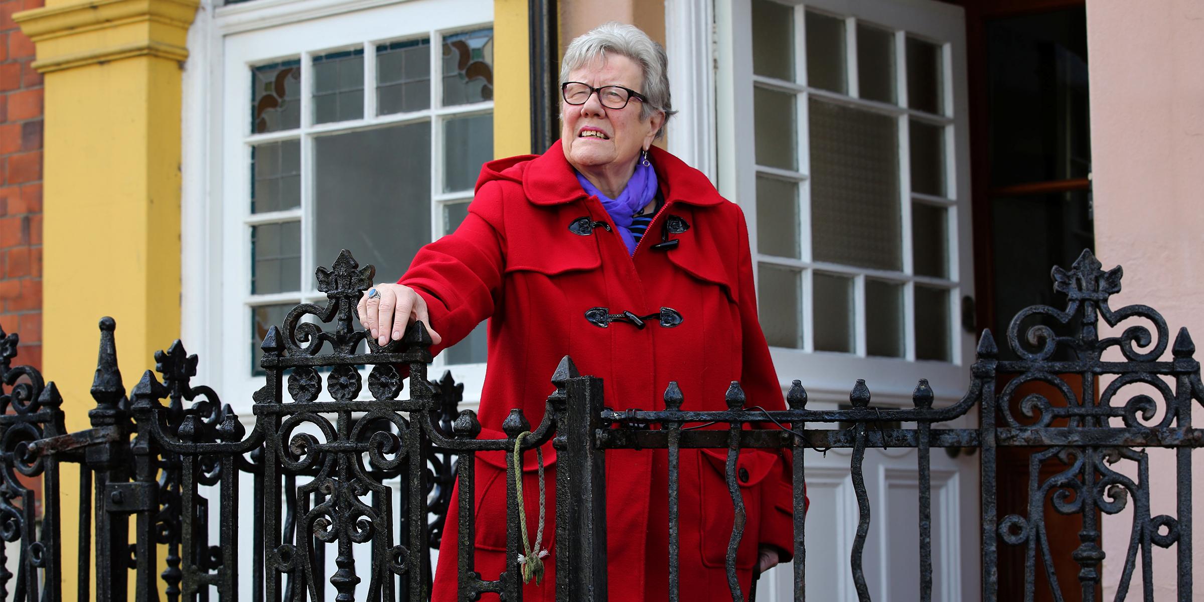 Anne outside her home