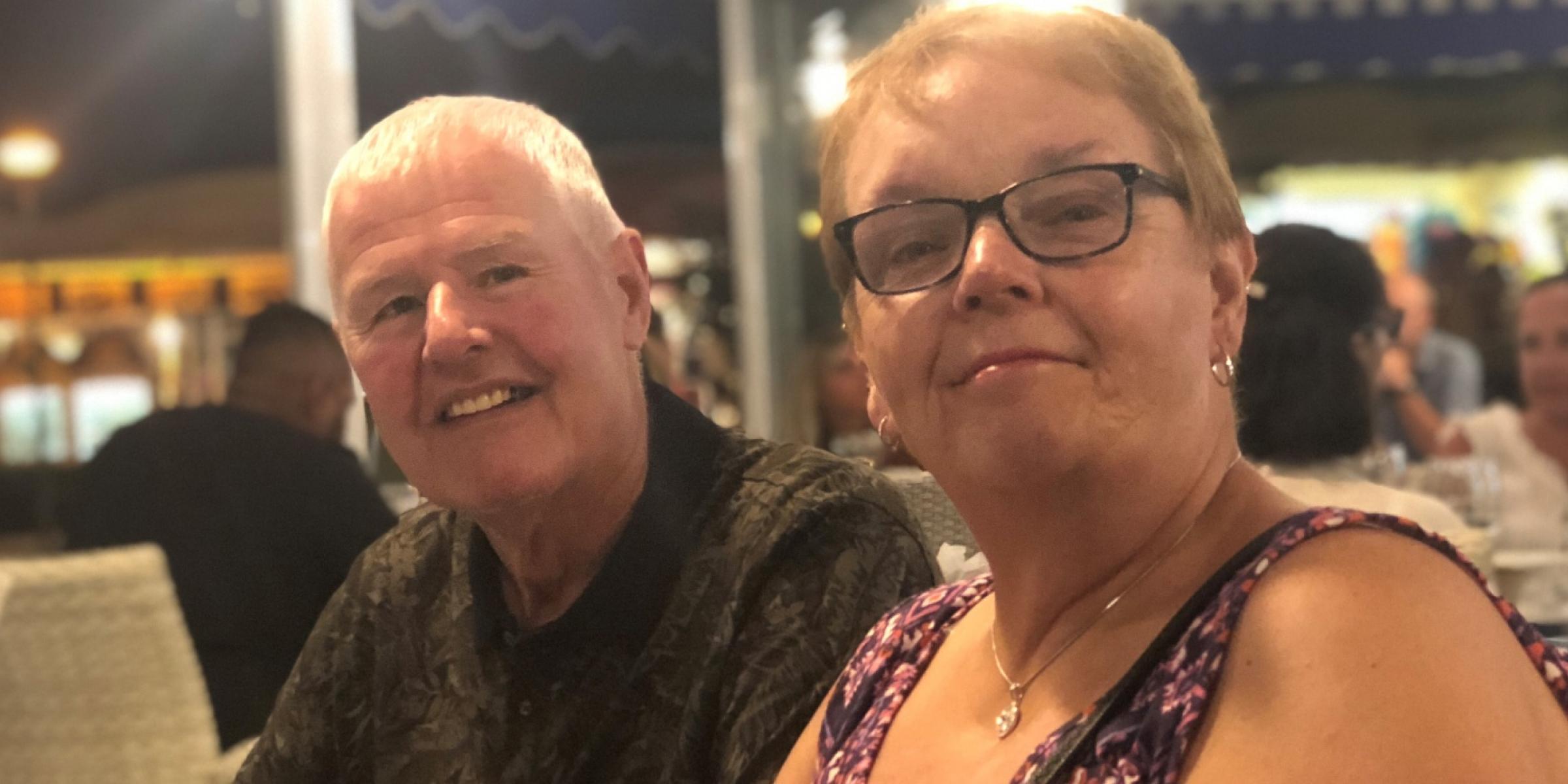 Jen's parents one evening, smiling