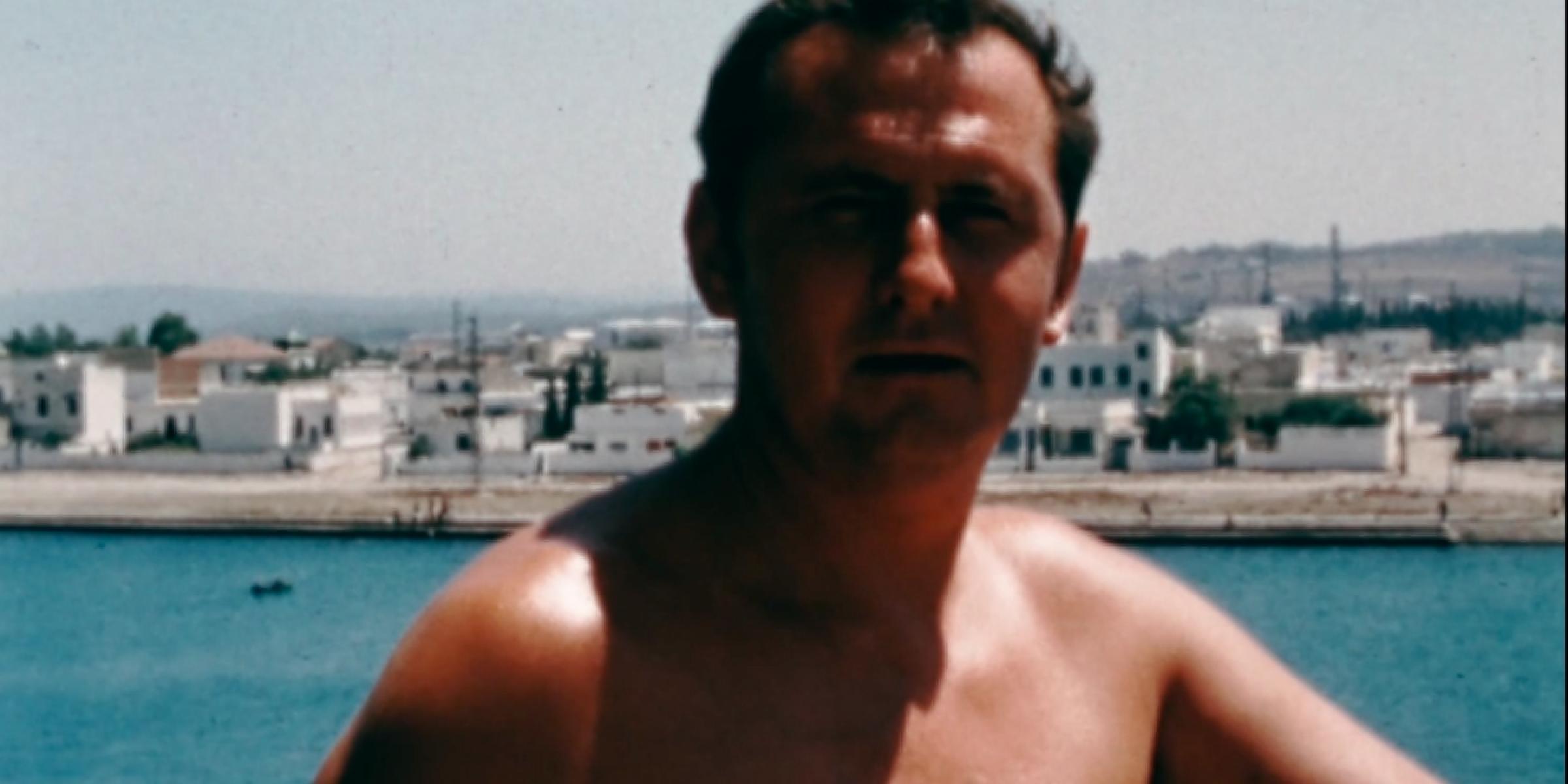 David's grandad pictured with the sea and coastline behind him