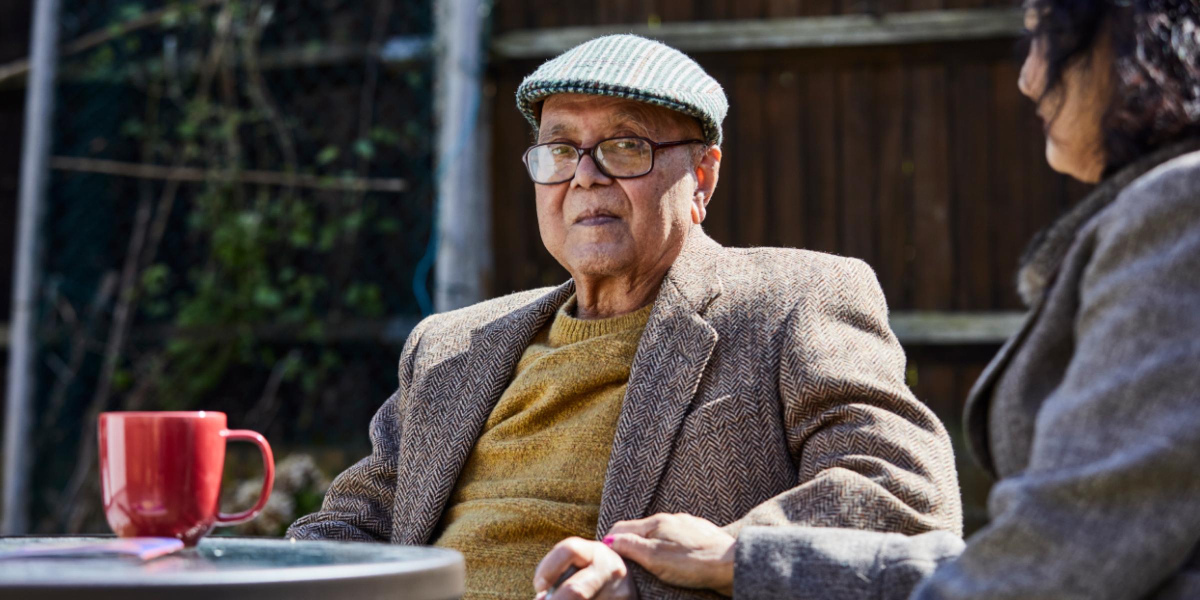 man in a garden with a friend