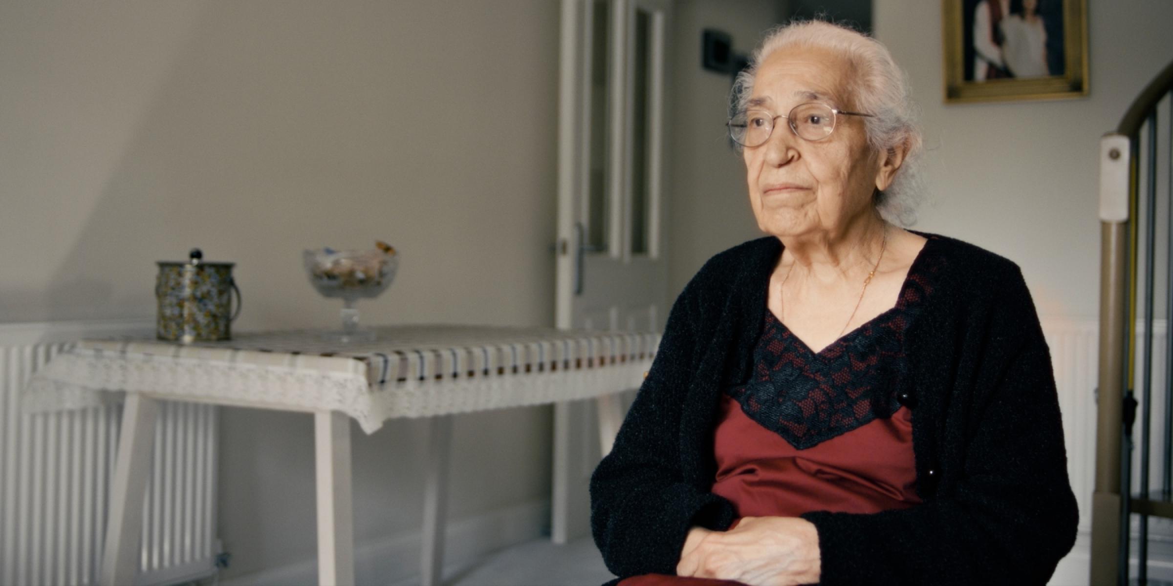 a woman sat with her arms folded