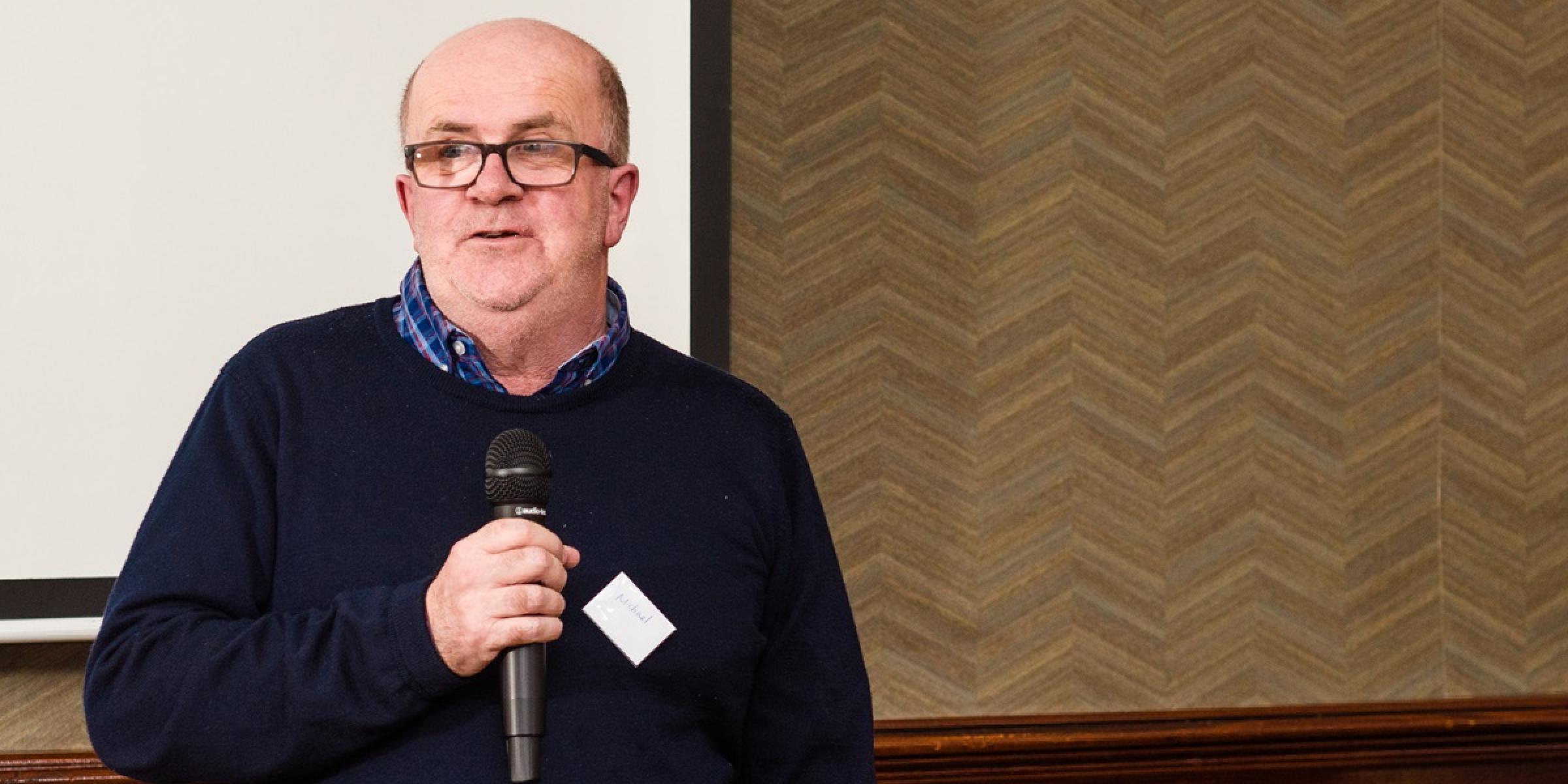A man with dementia presenting with a microphone