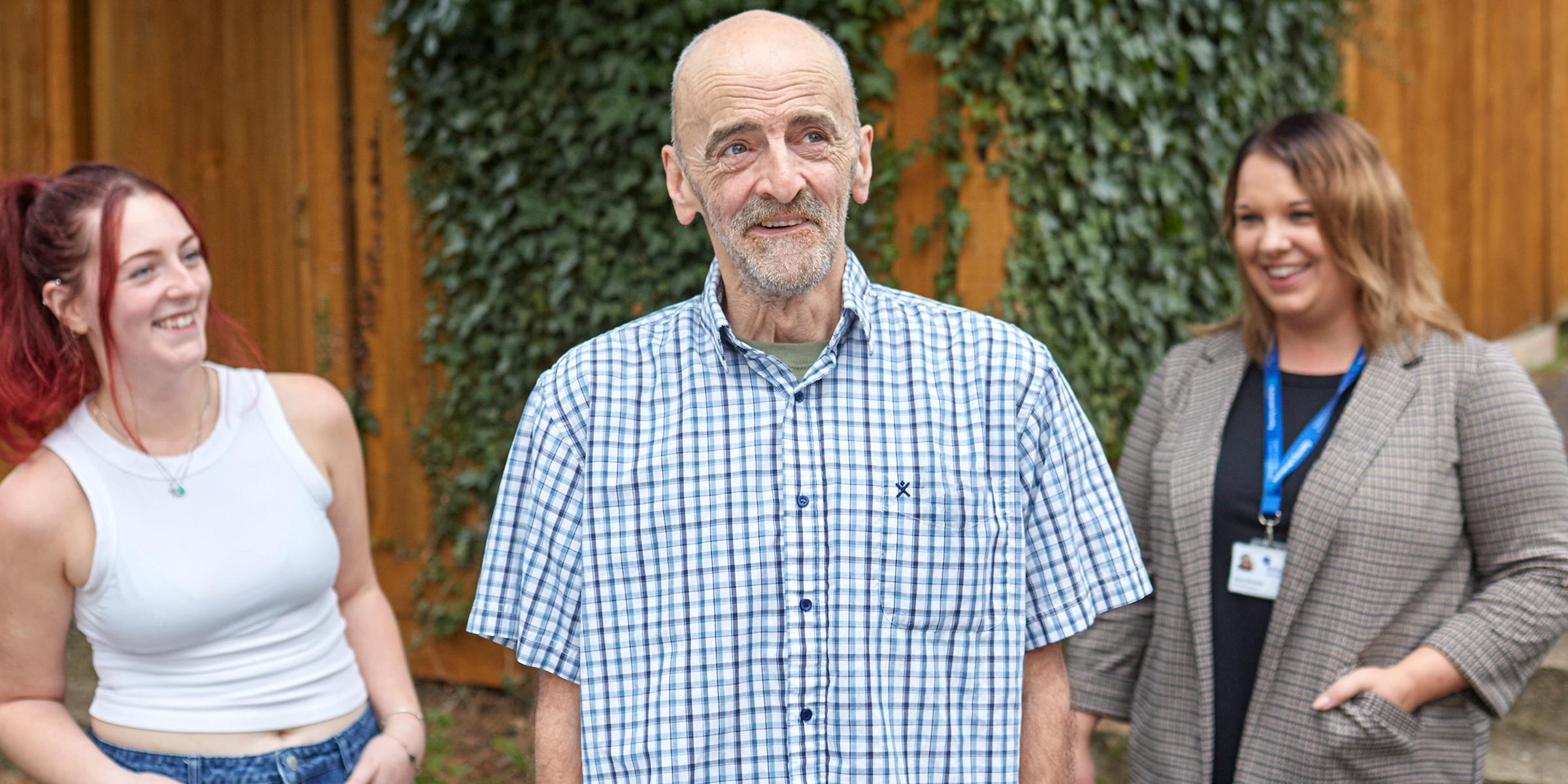 Mick Lambert with his daughter and his dementia adviser