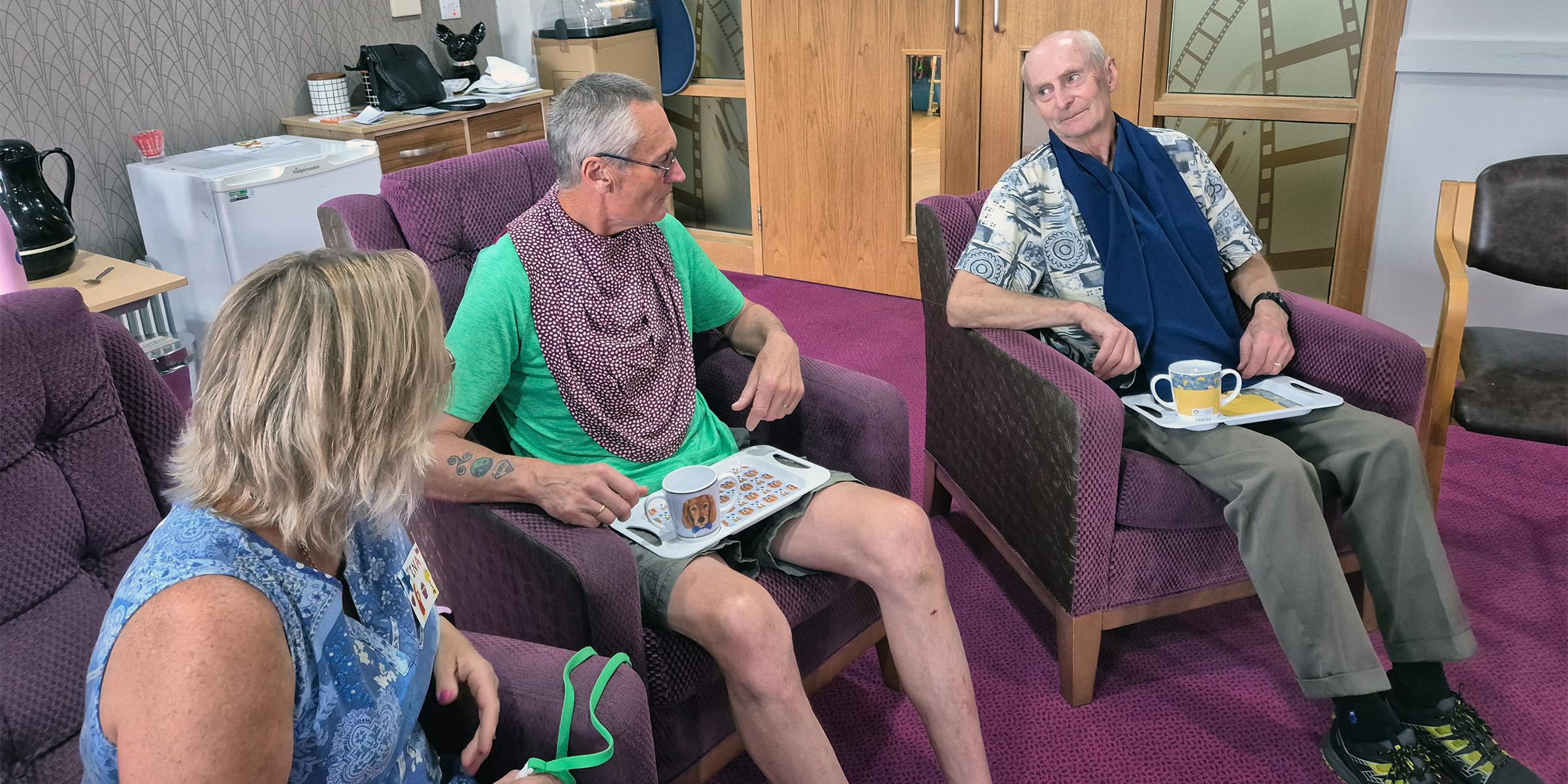 Norwich Dementia Voice local group trying out clothes protectors