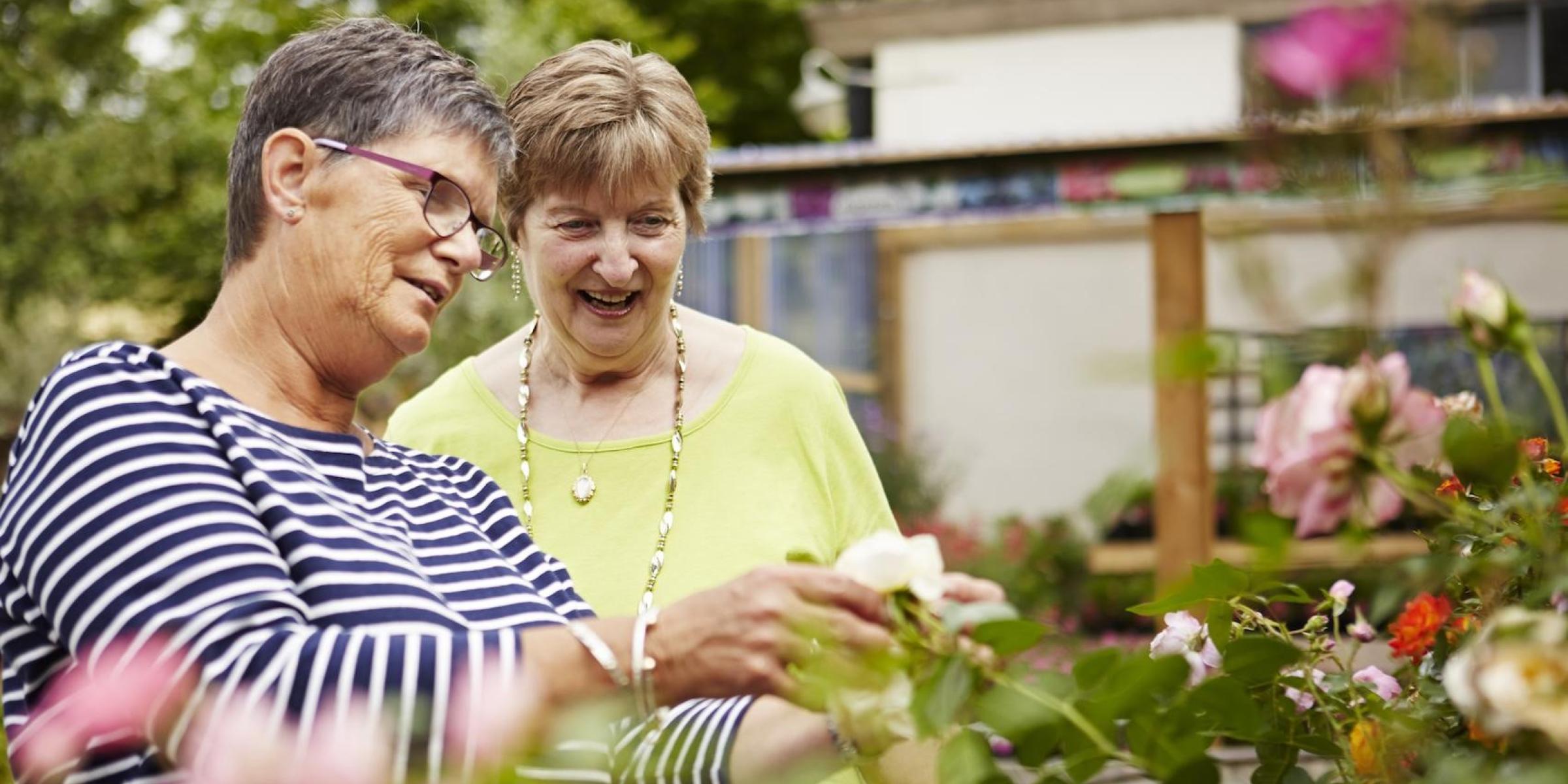 Two women looking at flowers
