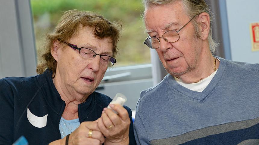 People trying out daily living aids