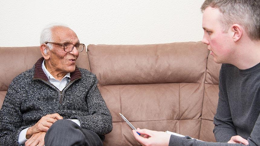 Magazine writer Gareth Bracken speaking to carer Pratap Sanghrajka