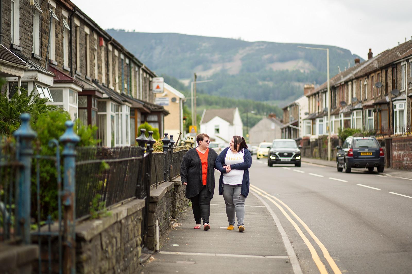 Amanda and her daughter Bethany walking outside