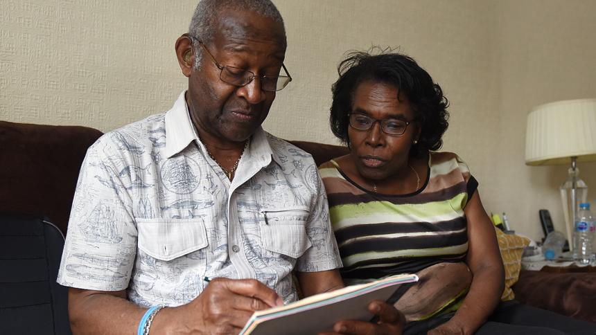 Raymond James drawing at home with his wife Cynthia