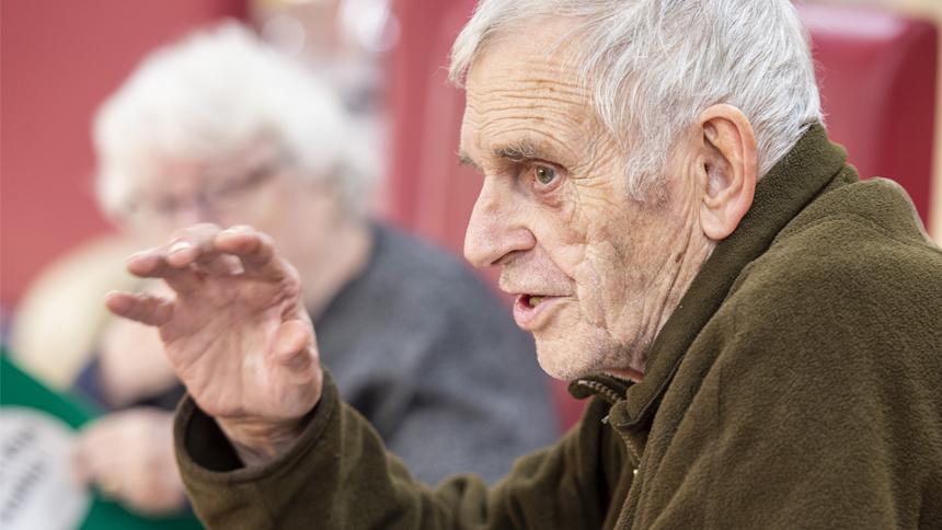 A book club member makes a point. 