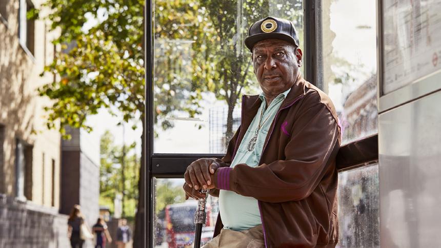 Gordon Lambert at a bus stop