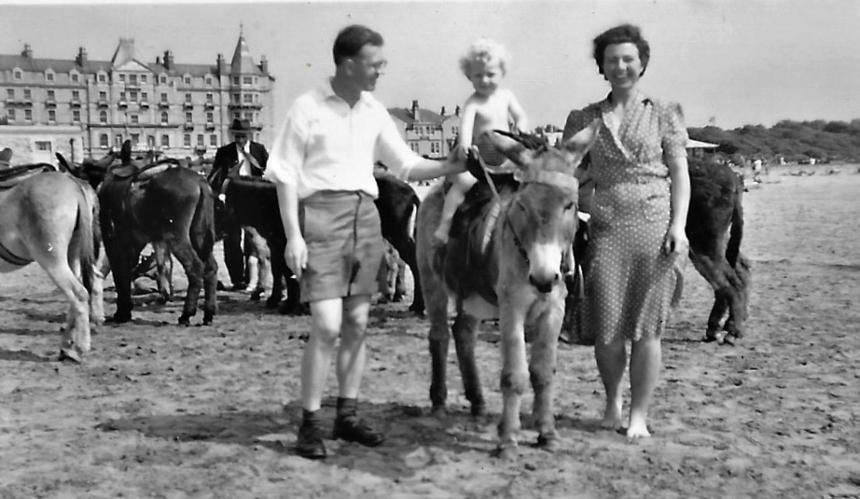 Tony Ward as a child with his parents while riding a donkey