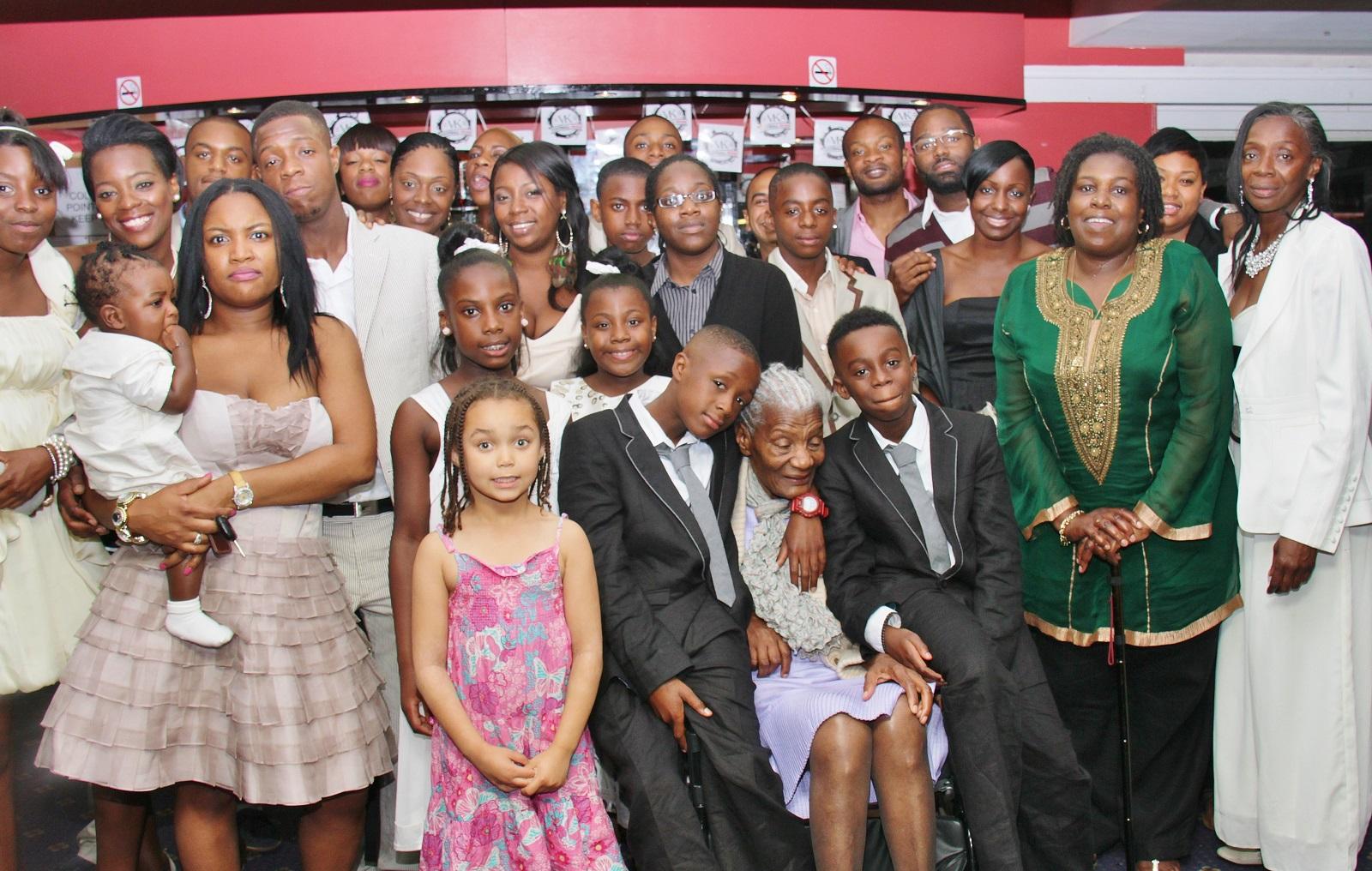 Thelma at the centre of a large family gathering