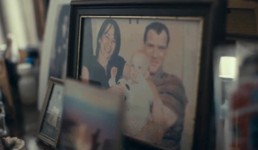 Framed family photographs on a bedroom dressing table