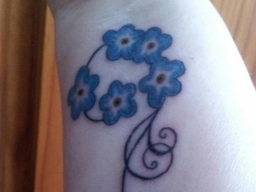 Diane Burgess' forget-me-not tattoo