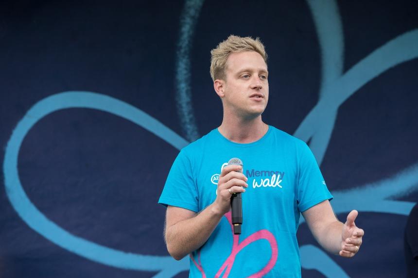Gareth Locke-Locke on stage, giving a speech at Memory Walk