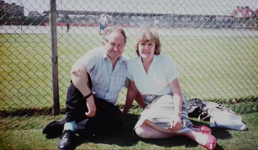James' grandparents sitting together on the grass