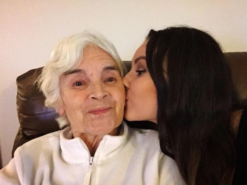 Kyra giving her grandma, Winifred, a kiss on the cheek