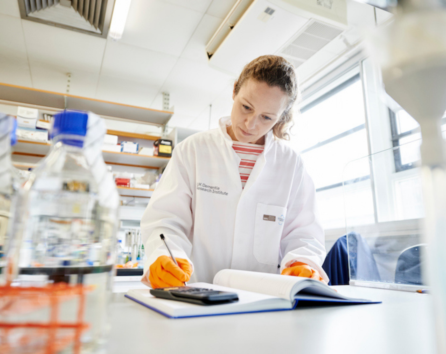 Researcher writing notes