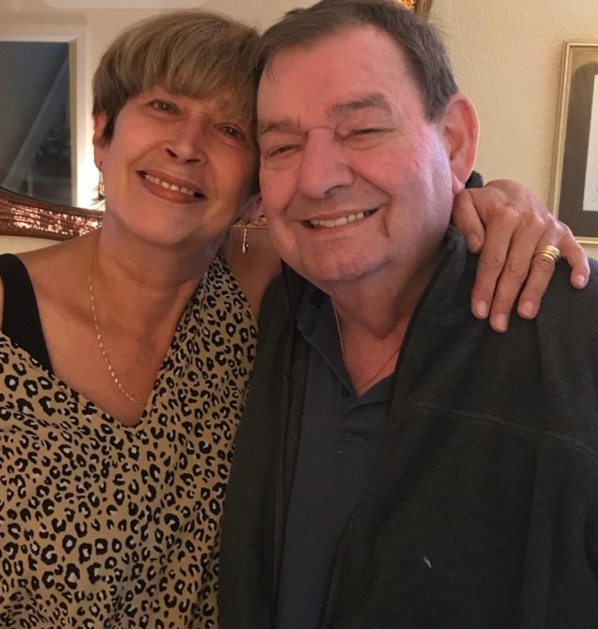 Candy with her arm round her husband Stan - both of them smiling