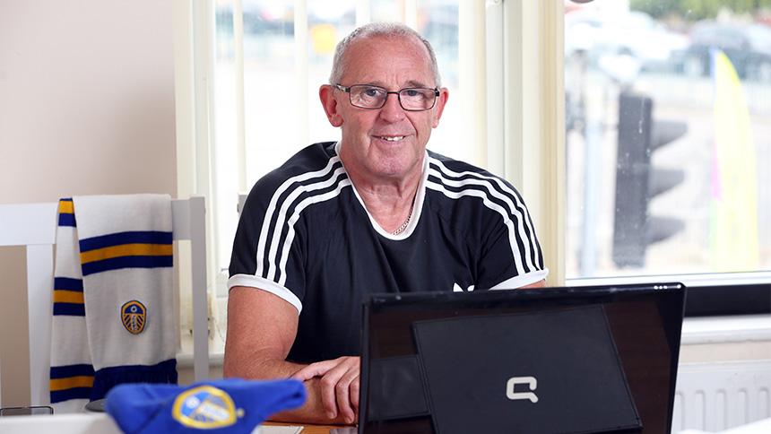 Andy Paul sitting at his computer.