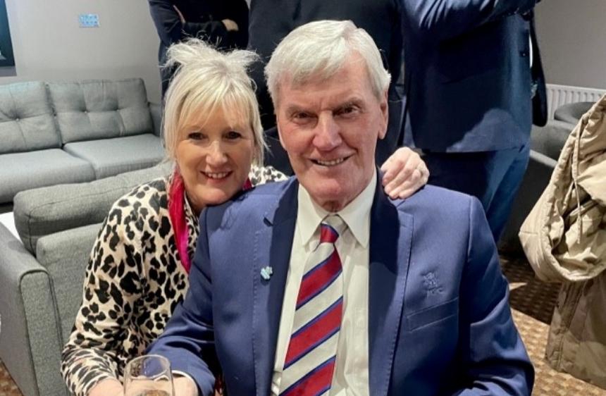 Diane with her arm round Alan, her dad