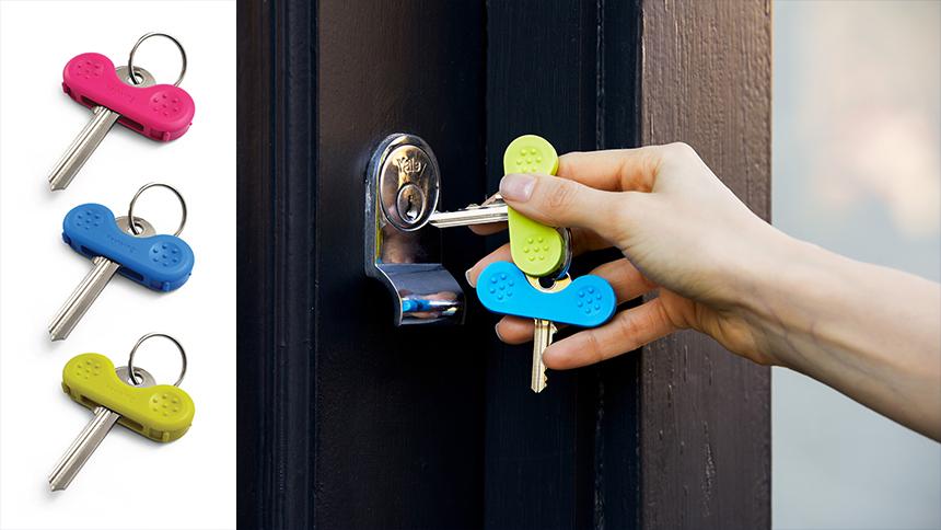 Keywings in their packaging (left) and being used by someone to unlock a door (right)