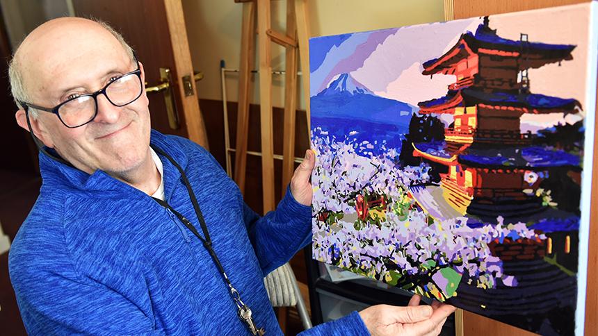 Warren Berman with one of his paintings