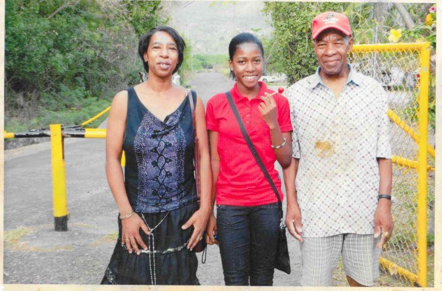 Rianna (centre) stands with her grandad, Terry (right)