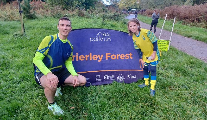 Craig poses with his daughter as they raise money