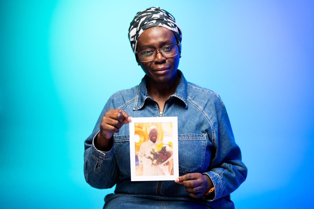 Beverly holds up a photo of her mother Janet with vascular dementia