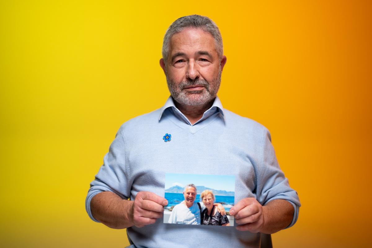 Trevor our dementia storyteller holds up a photo of his wife Yvonne, diagnosed with early onset Alzheimer's disease