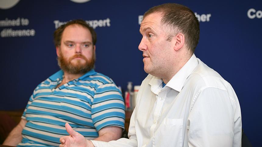 Adam (left) listens to Neil(right) talking