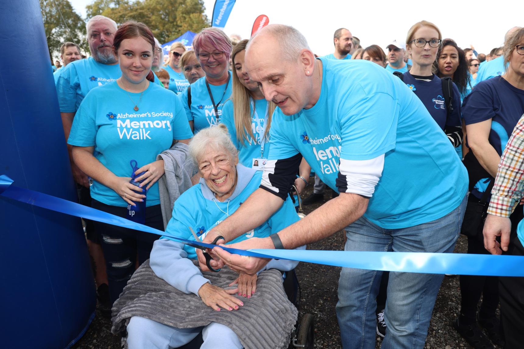 Coronation Street's Julie Goodyear cutting the Memory Walk start ribbon