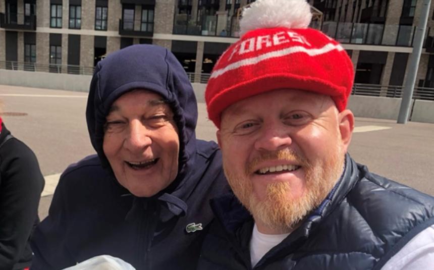 Paul and his dad smile into the camera